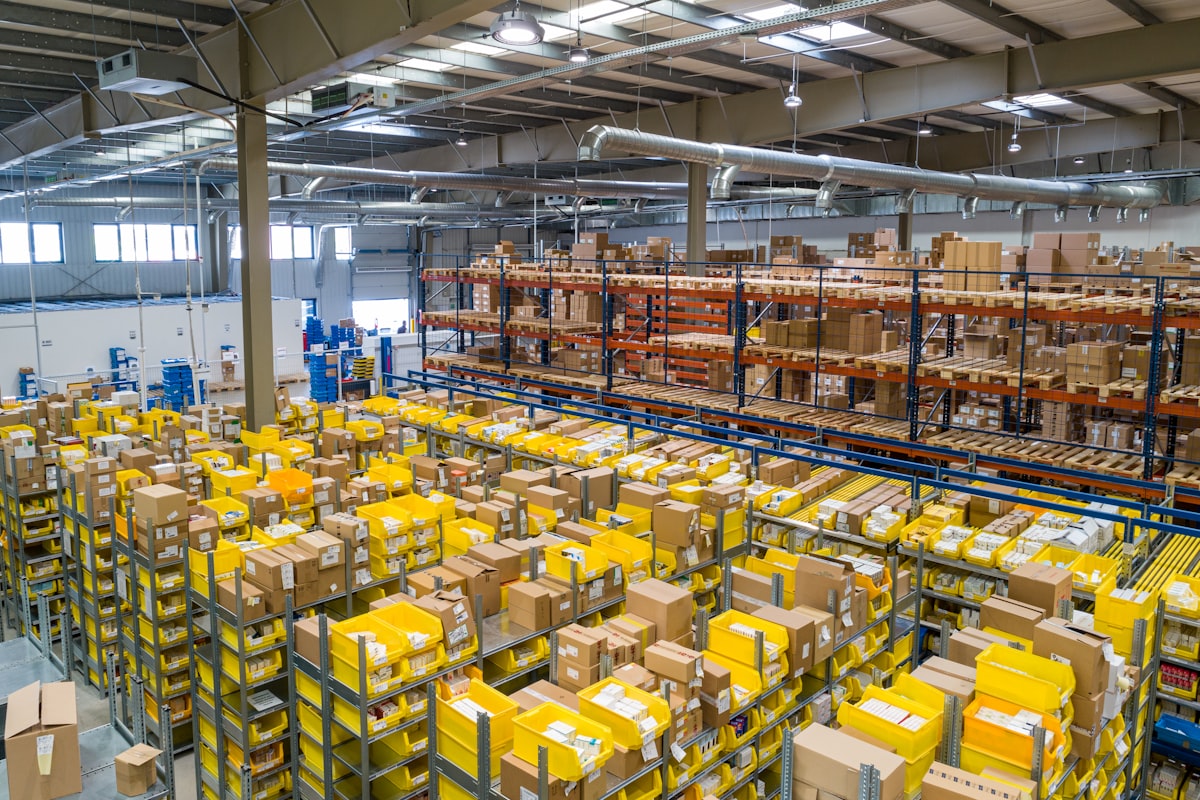 Interior of a modern distribution warehouse with racking and packages